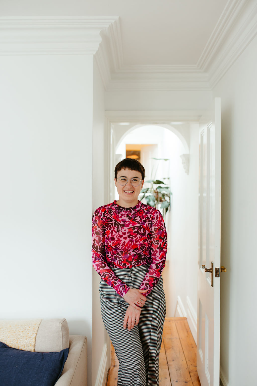 Chauncey Sjostedt, Gestalt Therapist and Psychotherapist, standing in her Surry Hills practice