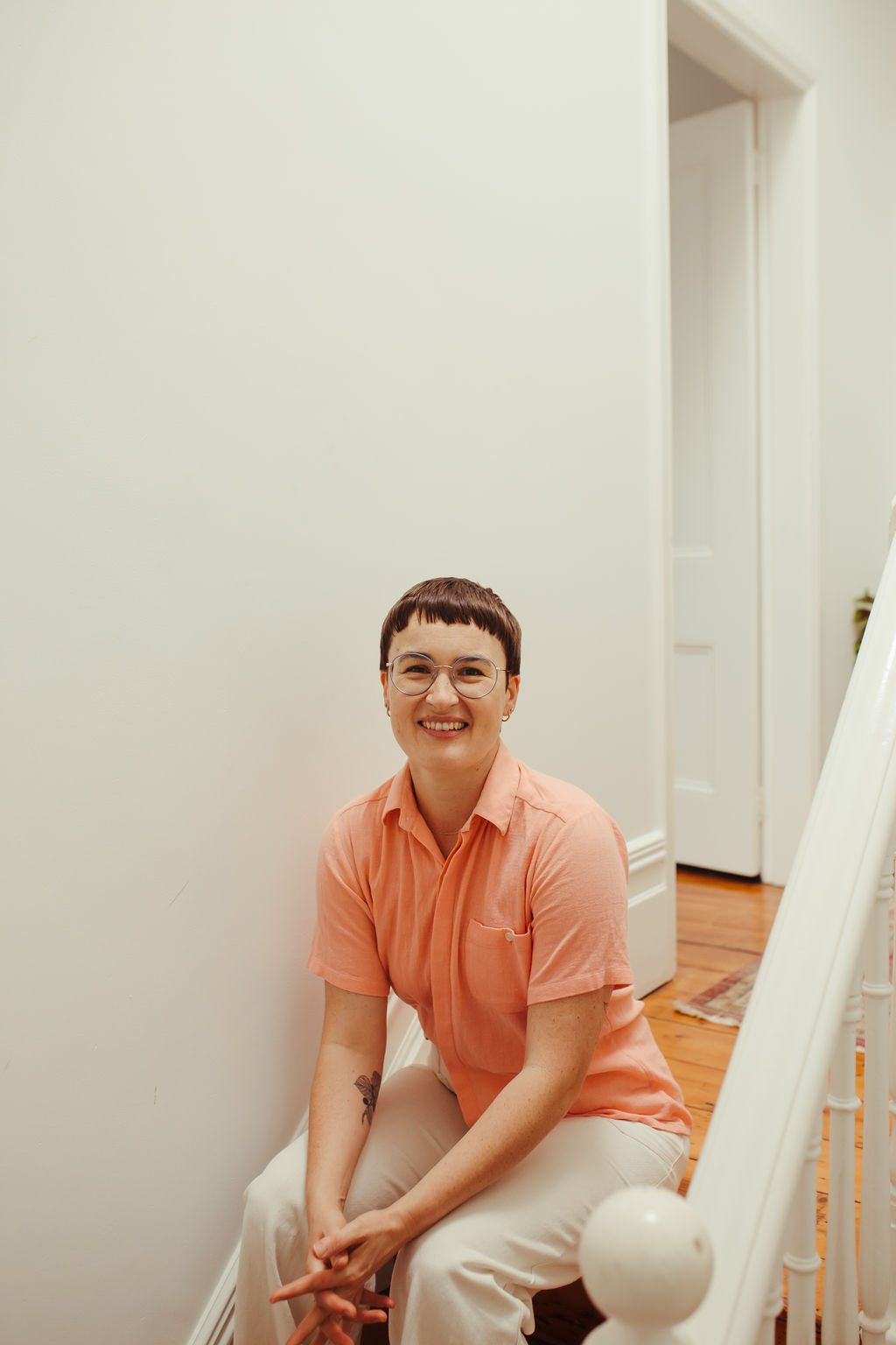 Chauncey Sjostedt, trauma therapist in Sydney, seated in a grounded and warm pose